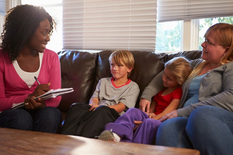 worker, social, children, parent, two, issue, horizontal, talking, people, one, with, family, poverty, home, meeting, indoors, notes, son, sofa, usa, sitting, neglect, four, daughter, writing, problem, together, discussion, mother