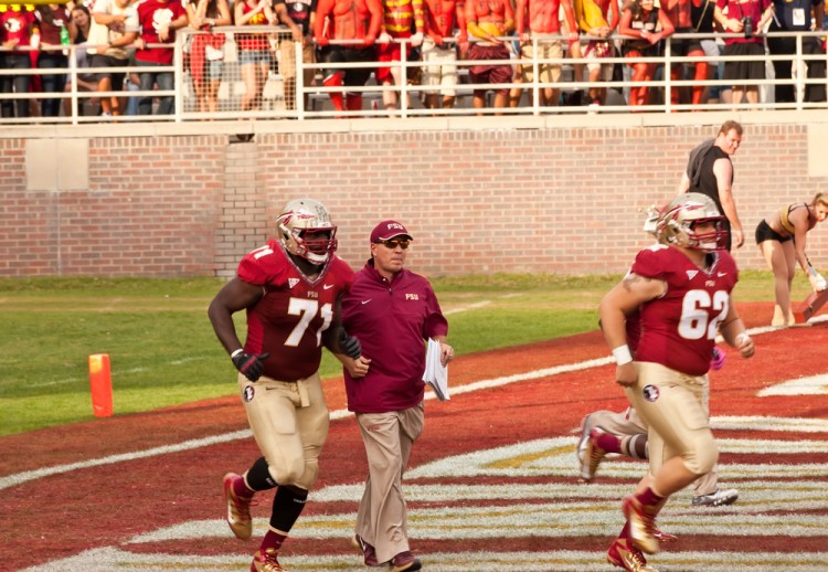 college students, helmets, tallahassee, fsu, cheering, football game, football players, field, football field, noles, head coach, defense, fans, people, doak campbell stadium, 11 Highest-paid College Football Coaches