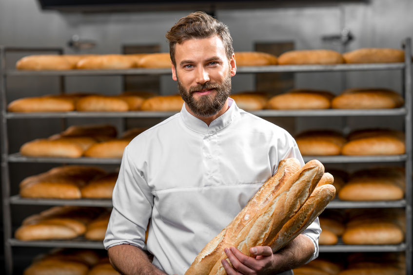 adult, baguette, bake, bakehouse, baker, bakery, baking, bread, bread baking, bun, caucasian, cheerful, chef, commercial, factory, food, fresh, gourmet, handsome, happy, indoors, industrial, industry, job, male, man, manufacture, manufacturing, model, occupation, person, portrait, production, profession, professional, rows, shelves, shop, smiling, standing, tasty, uniform, worker, working, workplace